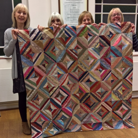 A Group of Morton Quilters showing their work